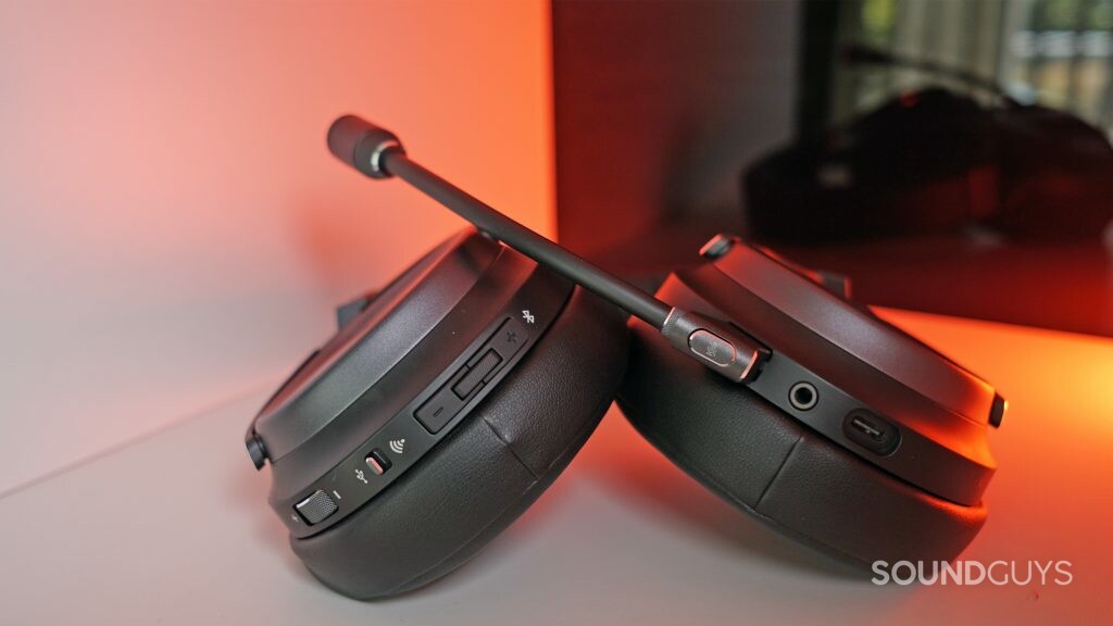 The Corsair Virtuoso lays on a white shelf with a red light in the background.