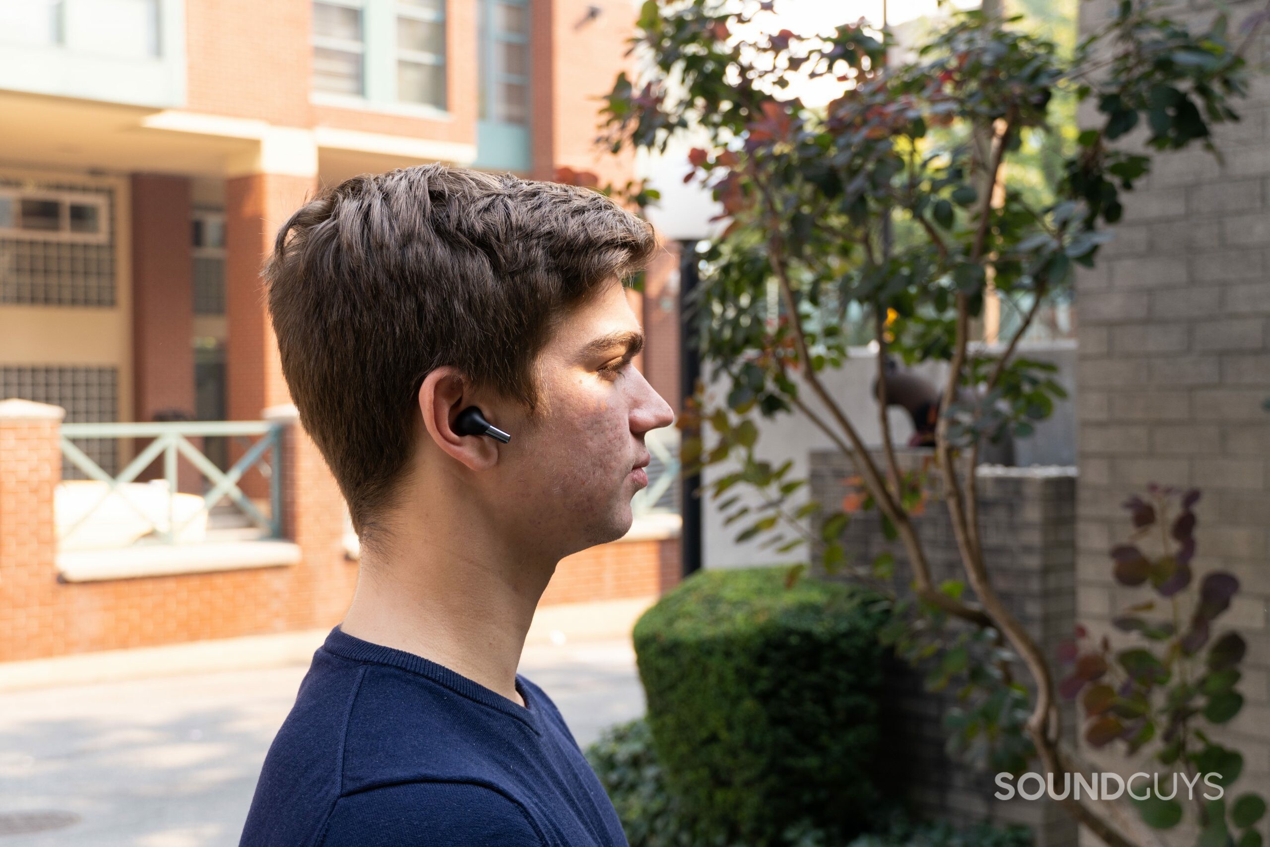 OnePlus Buds Pro in ear outside.