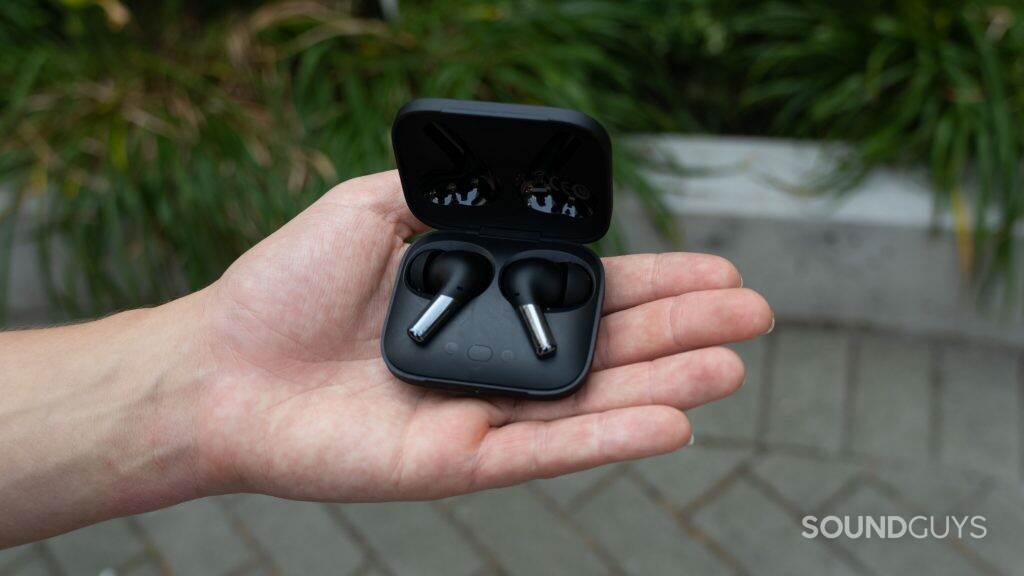 OnePlus Buds Pro in hand.