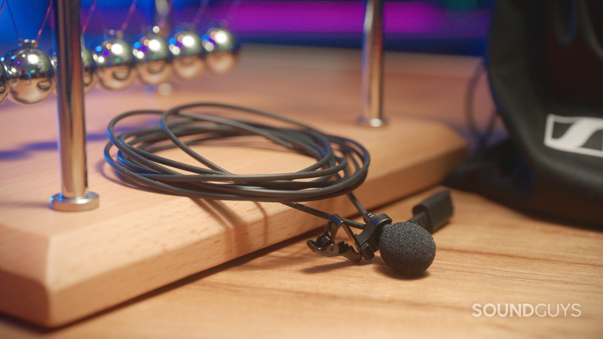 The Sennheiser XS Lav USB-C on top of Newton's Cradle.