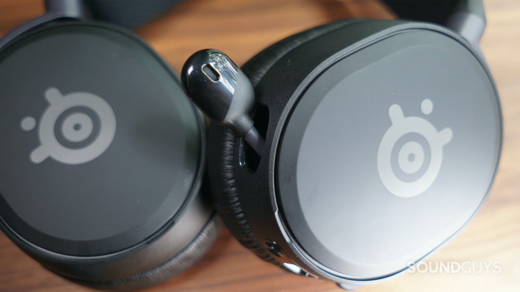 A close up shot of the SteelSeries Arctis Prime gaming headset microphone partially retracted into the headset.