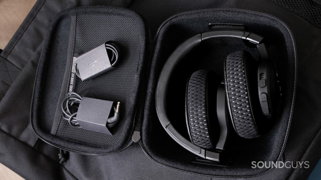 Under Armour Project Rock by JBL headphones appears folded in the included case with cable accessories.
