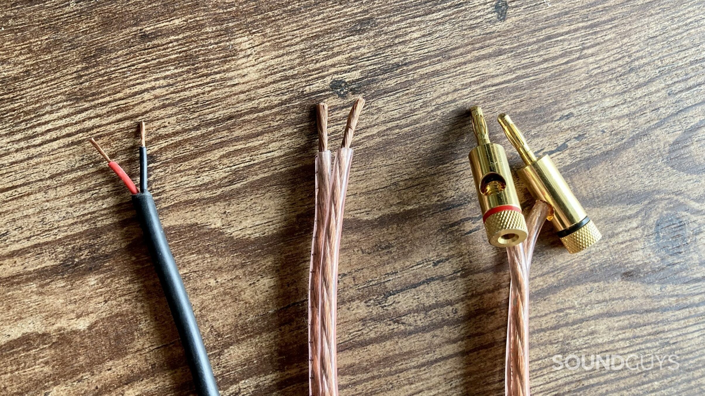 3 speaker cables showing bare end terminations, as well gold plated banana plugs.