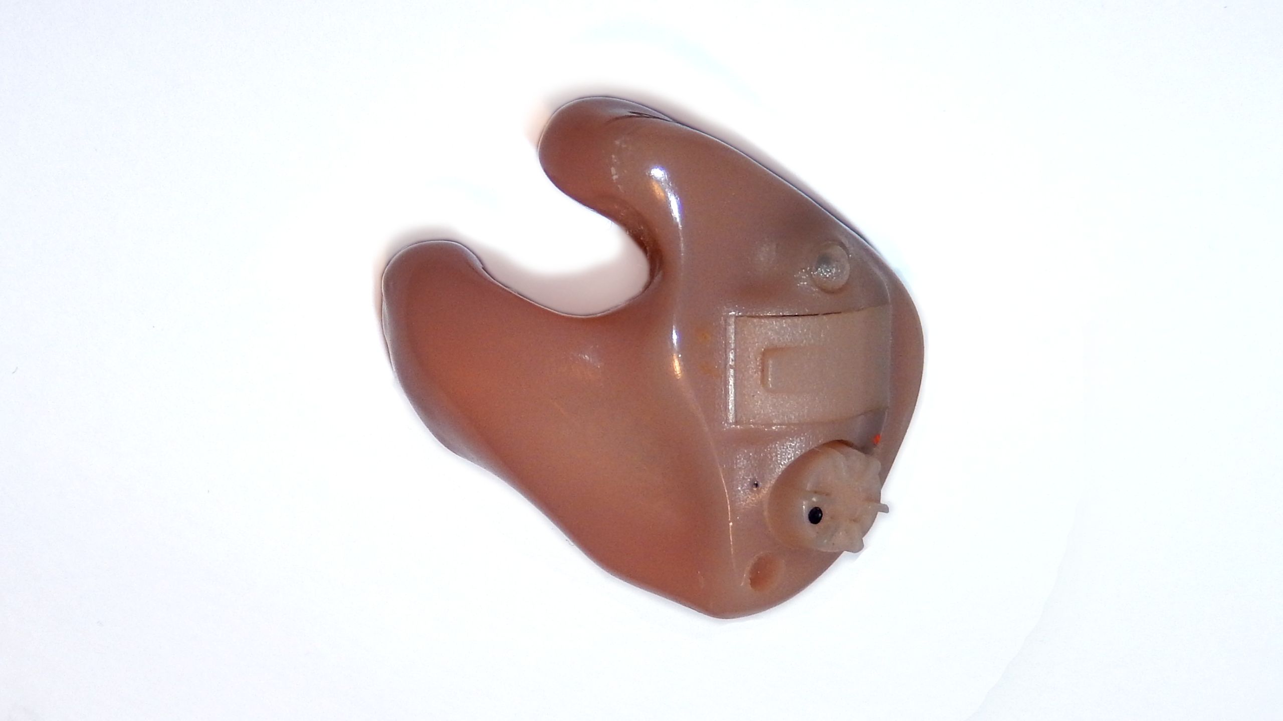 An in-the-ear hearing aid with a custom-fit earmold.