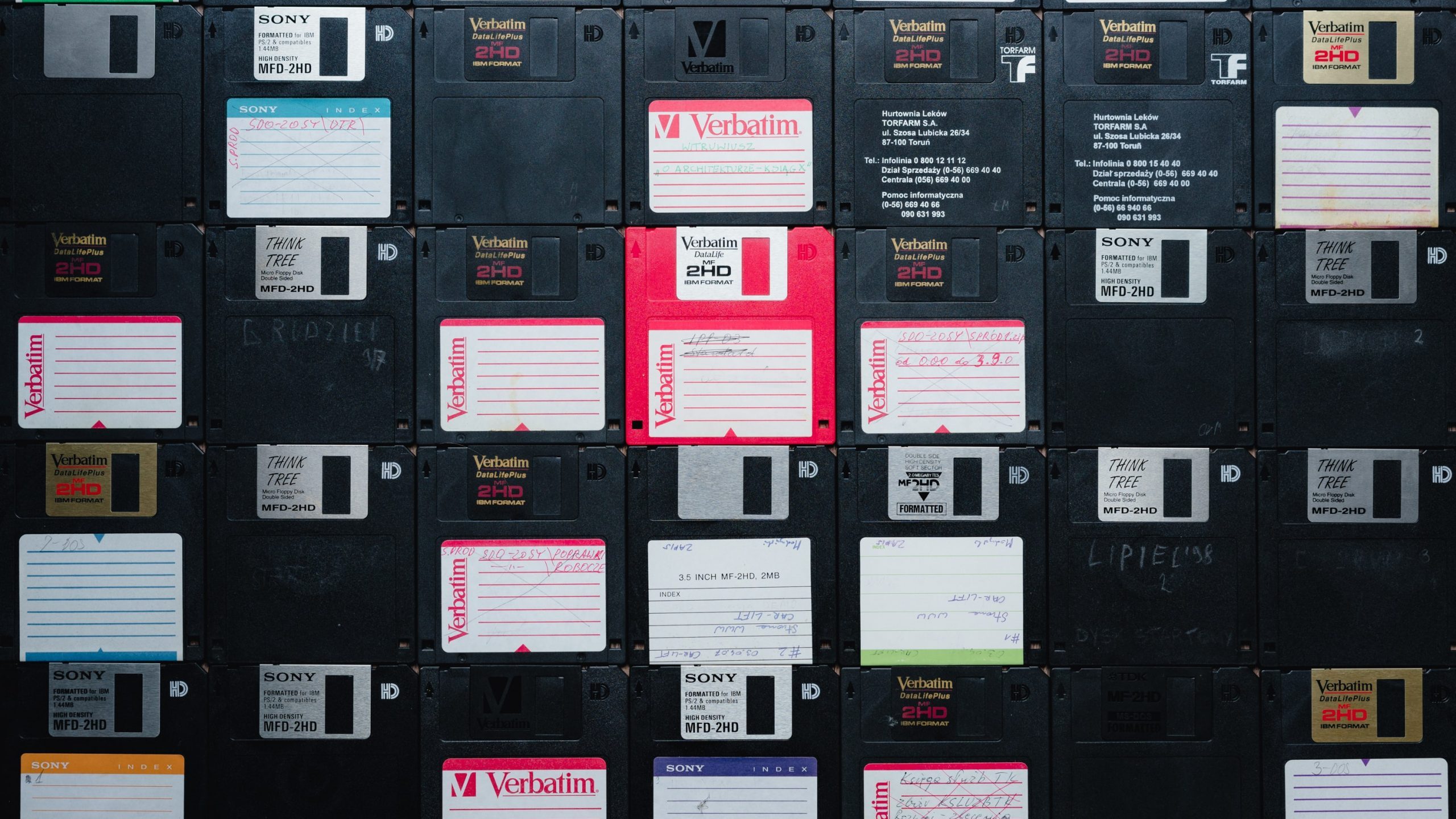 s-migaj-ocUAiaMTCM0-unsplash An array of old school 3.5" floppy disks.