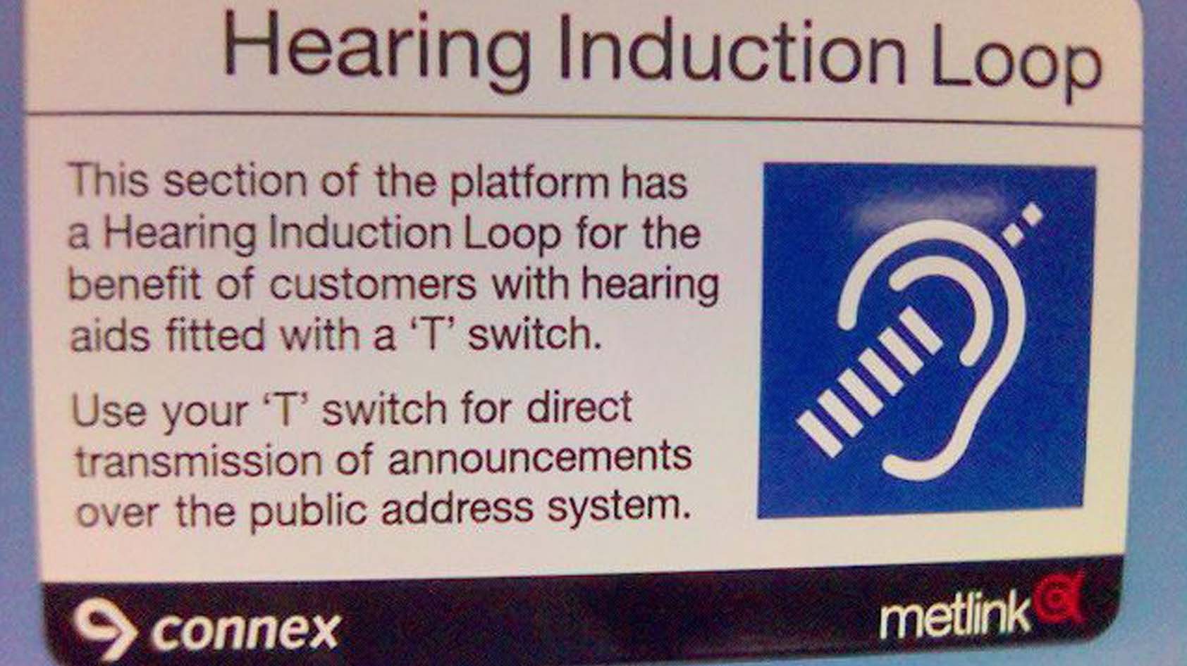 A sign points out that a hearing induction loop is available for use with a hearing aid.