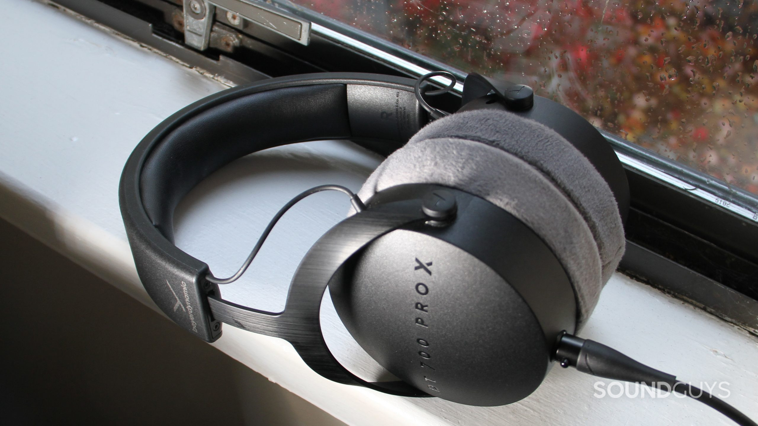 beyerdynamic-dt-700-pro-x-center A set of Beyerdynamic DT 700 Pro X rests on a white window sill.
