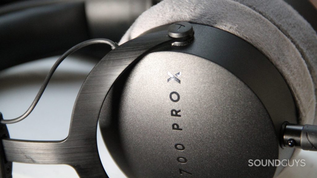 A close up of the Beyerdynamic DT 700 Pro X displaying the brushed and textured metal housing.