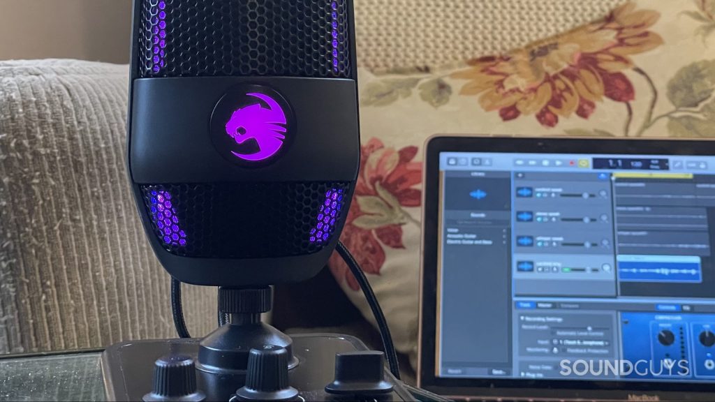 The Roccat Torch zoomed into its logo with a DAW open on a laptop in the background.