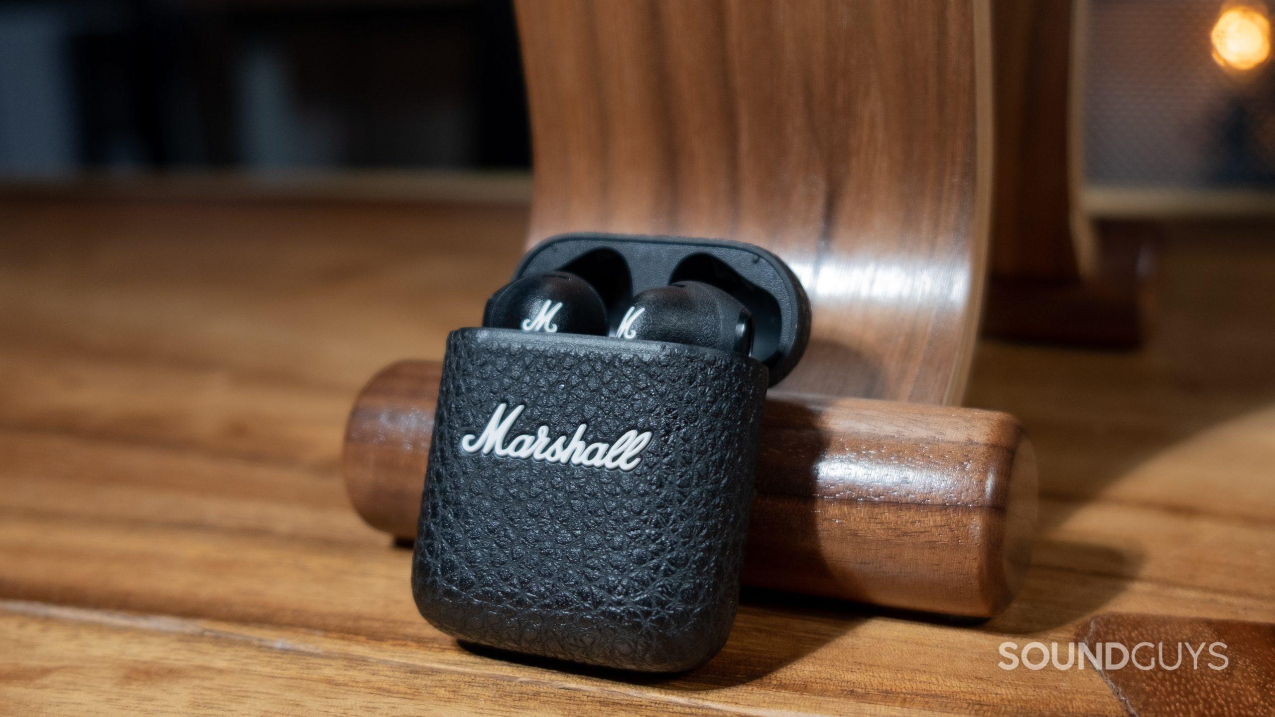A centered image shows the Marshall Minor III on a wood desk open with the buds showing.