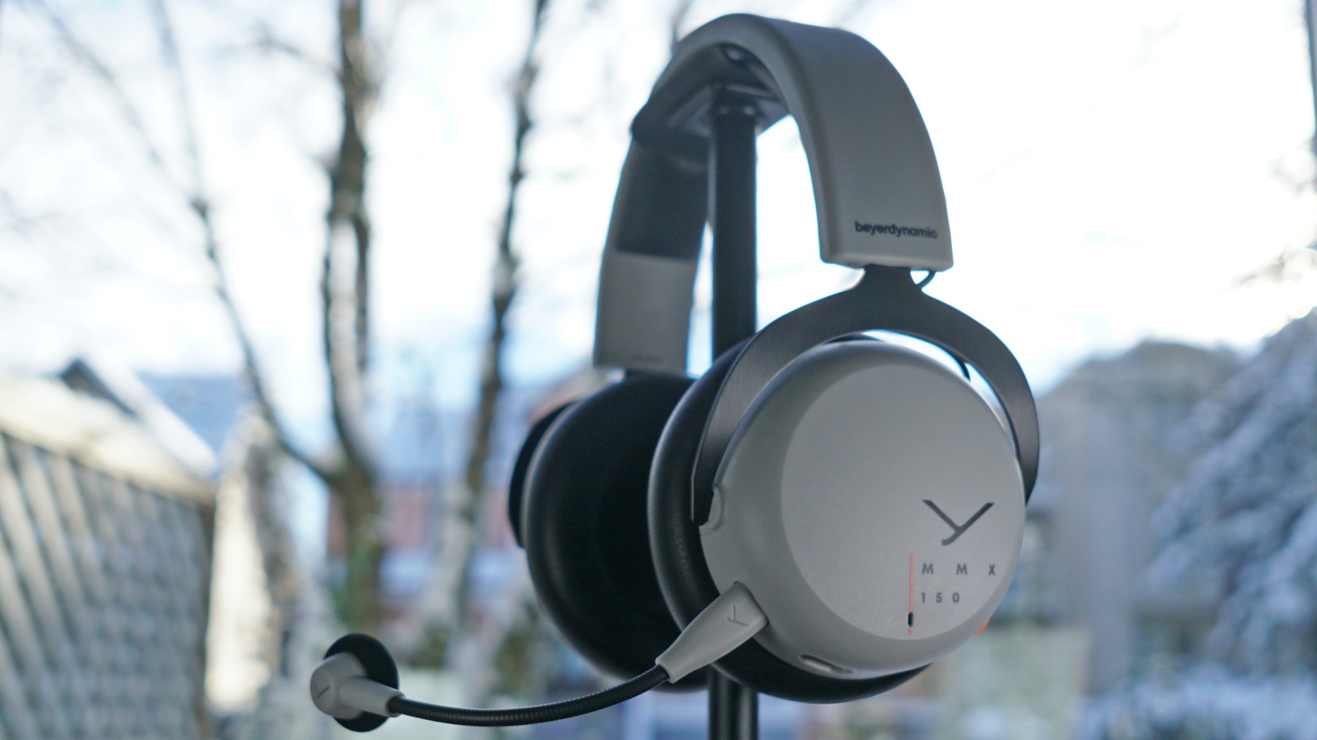 The Beyerdynamic MMX 150 sits on a headphone stand.