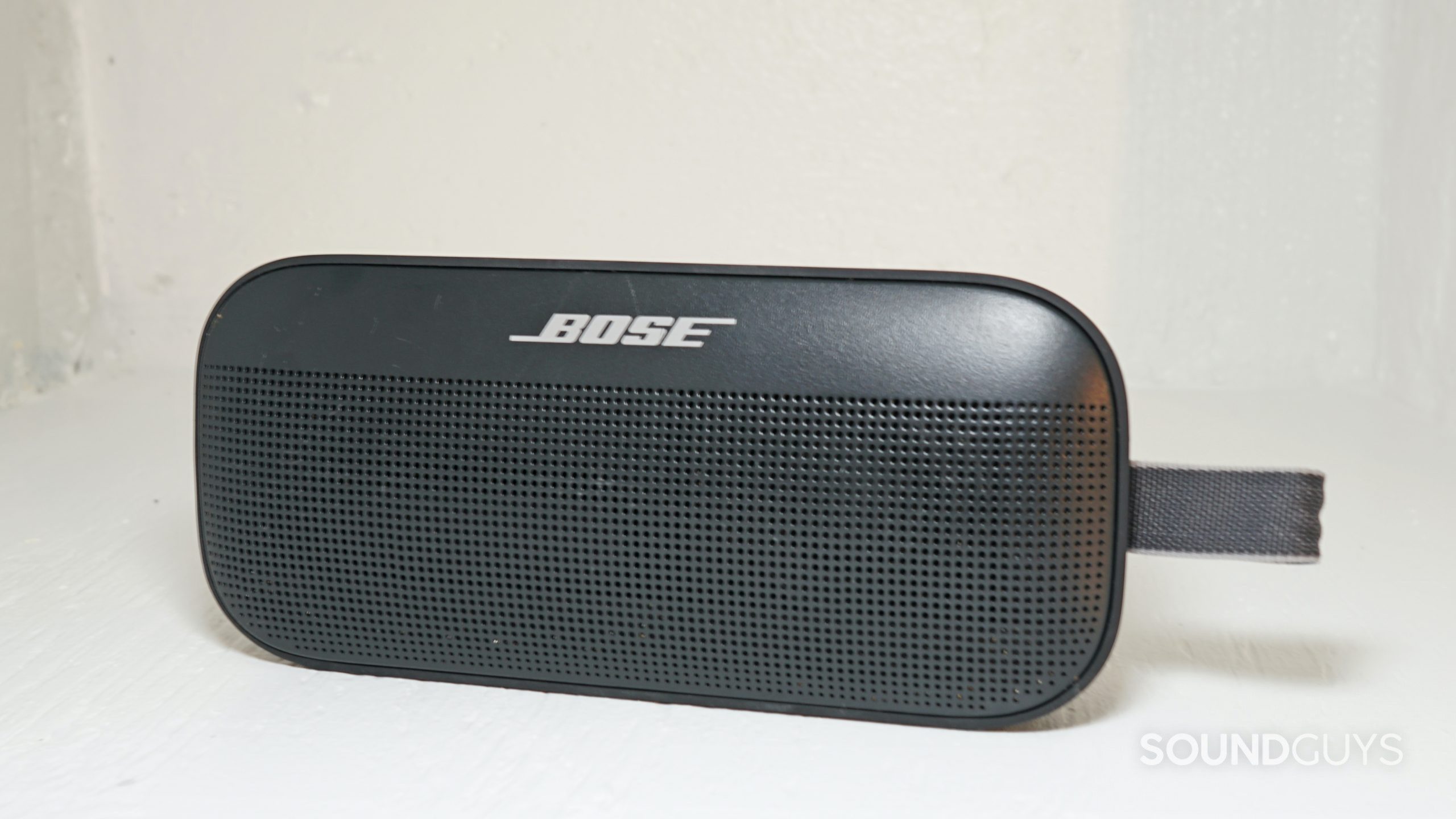 A head-on shot of a Bose SoundLink Flex Bluetooth speaker showing the grille, carrying loop, and logo.