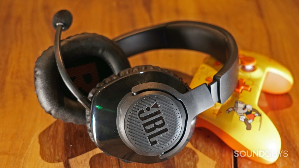 JBL Quantum 350 Wireless headset on a table beside a Cuphead branded controller for the Nintendo Switch.