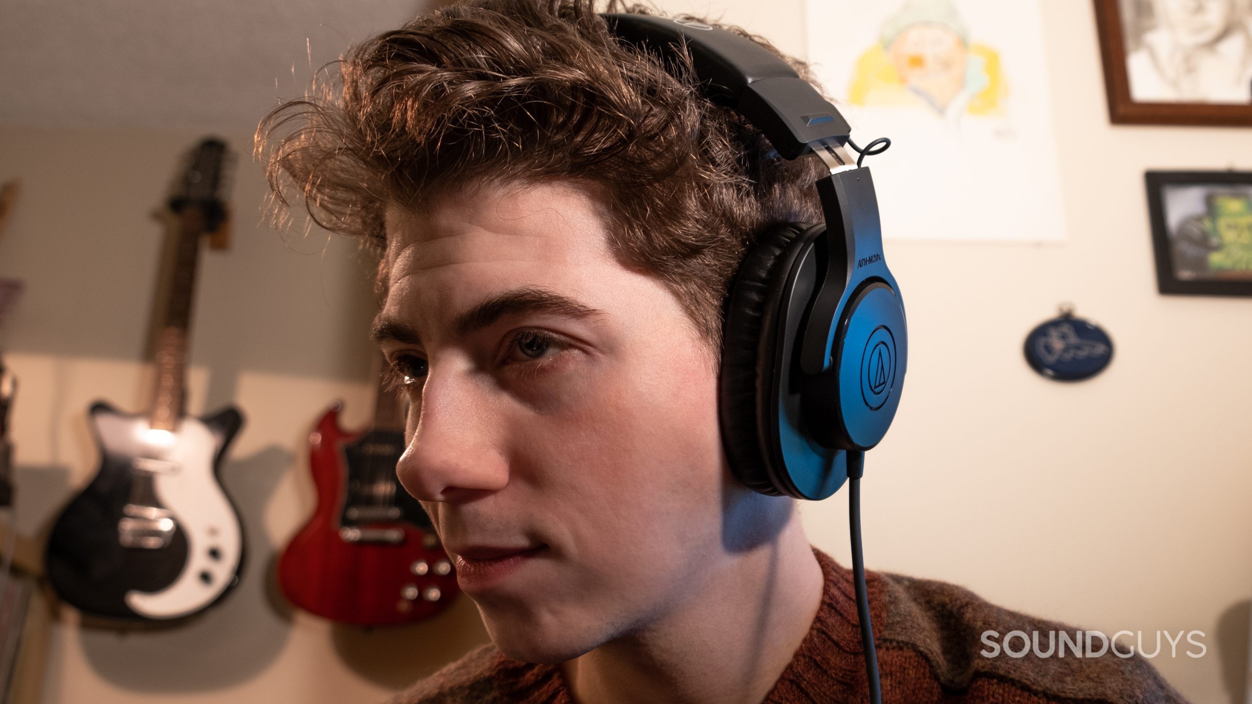 A man wear the Audio-Technica ATH-M20x looking left.