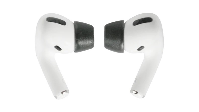 A left and right Apple AirPods Pro earbuds next to each other equipped with black Comply memory foam ear tips against a white background.