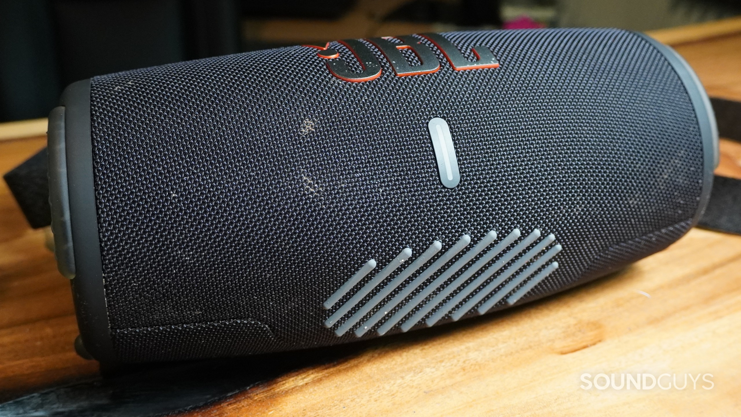 The JBL Xtreme 3 Bluetooth speaker showing a flat, textured area on its bottom with no feet installed.