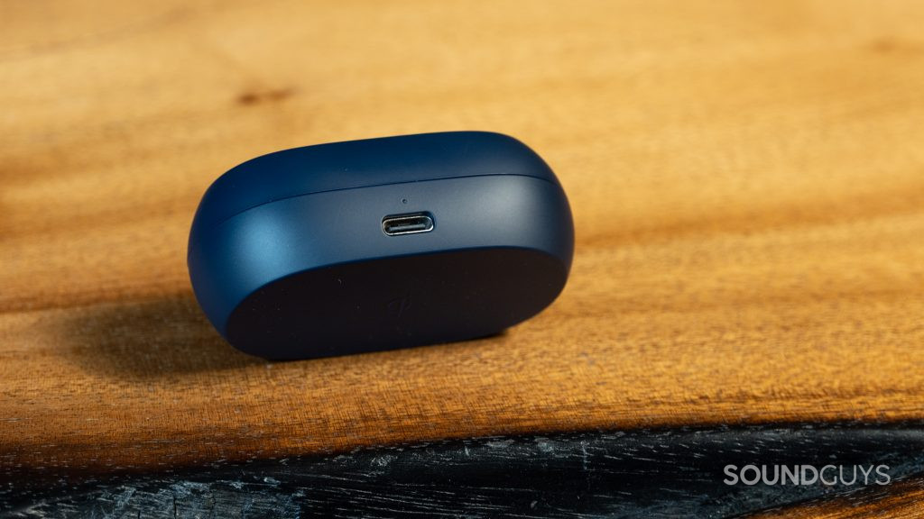 Jabra Elite 7 Active charging case placed on a wood surface.