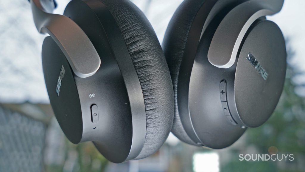 The Shure AONIC 40 hangs in front of a window with its controls in full view.