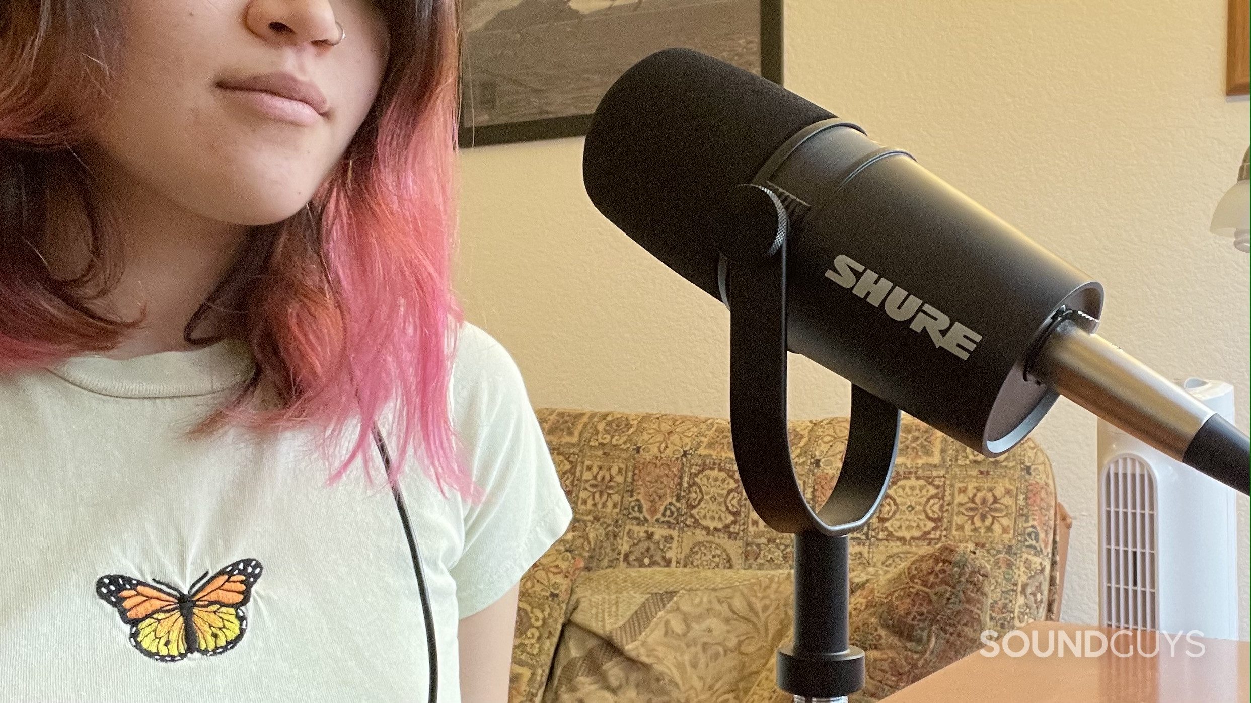 Woman using the Shure MV7X.