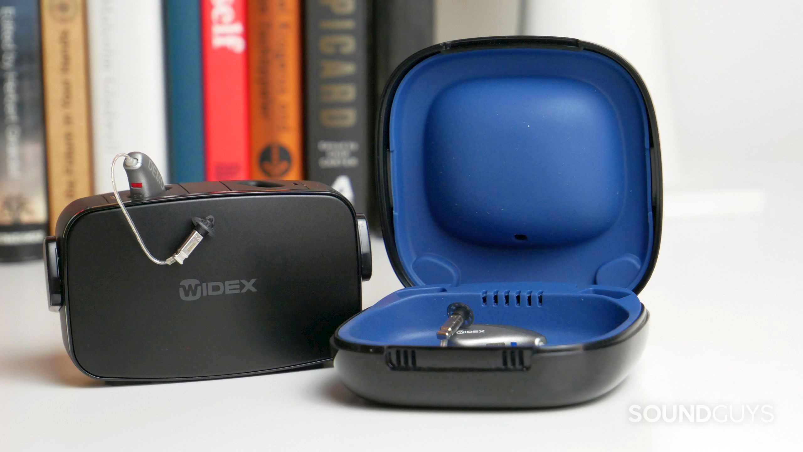 Widex MOMENT with carrying case and charging station.
