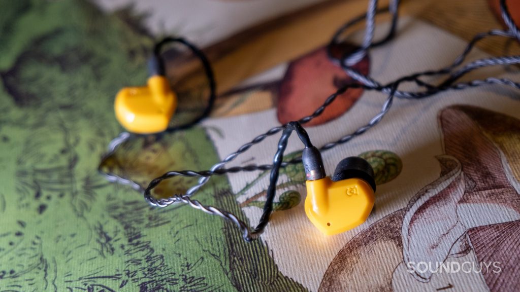 Close up of the Campfire Audio Honeydew showing the red dot and R on the cable to distinguish left from right.