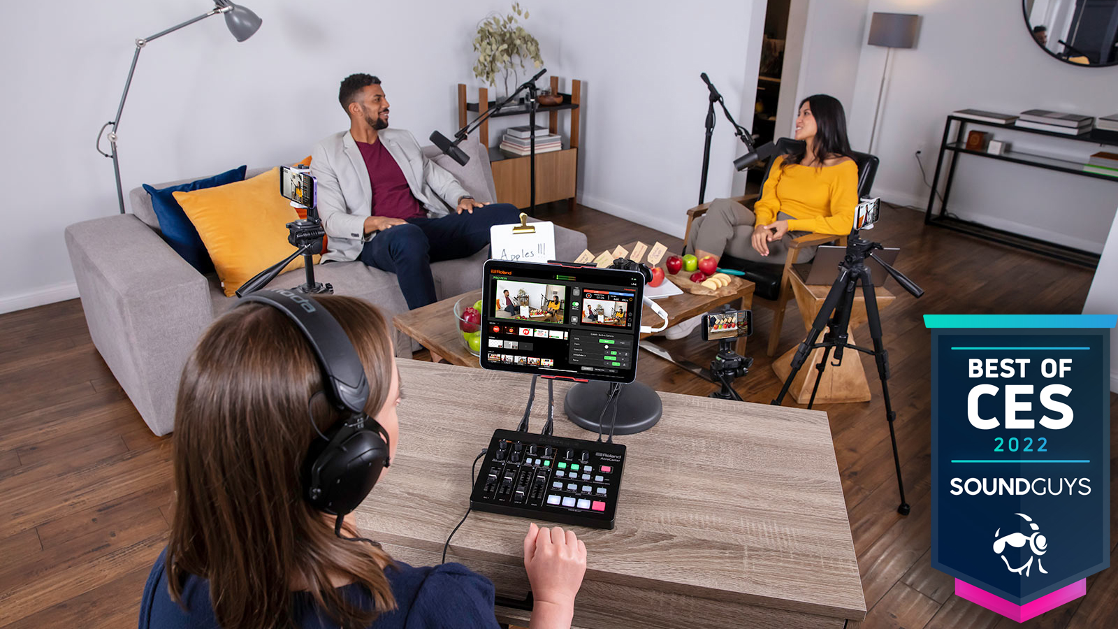 the Roland AeroCast platform being used in a living room setting with two subjects.