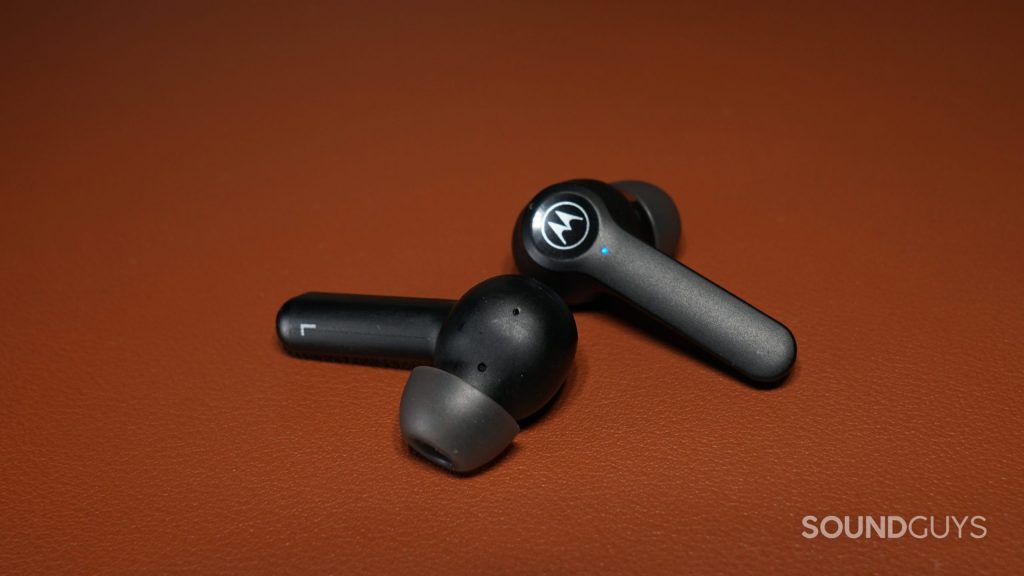 The Motorola Moto Buds S ANC lay on a leather surface.