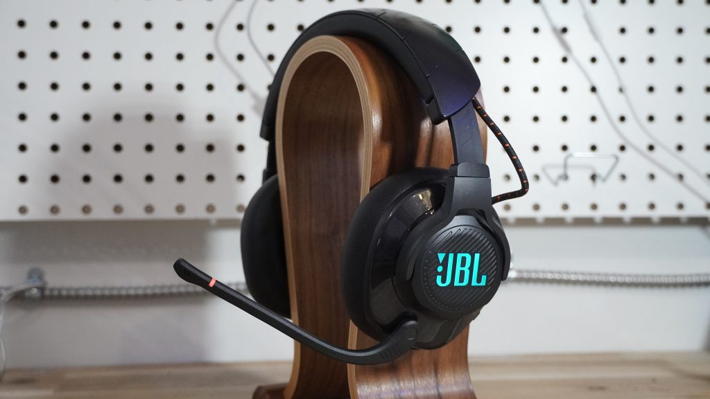 Photo of the JBL Quantum 600 on a wooden headphone stand