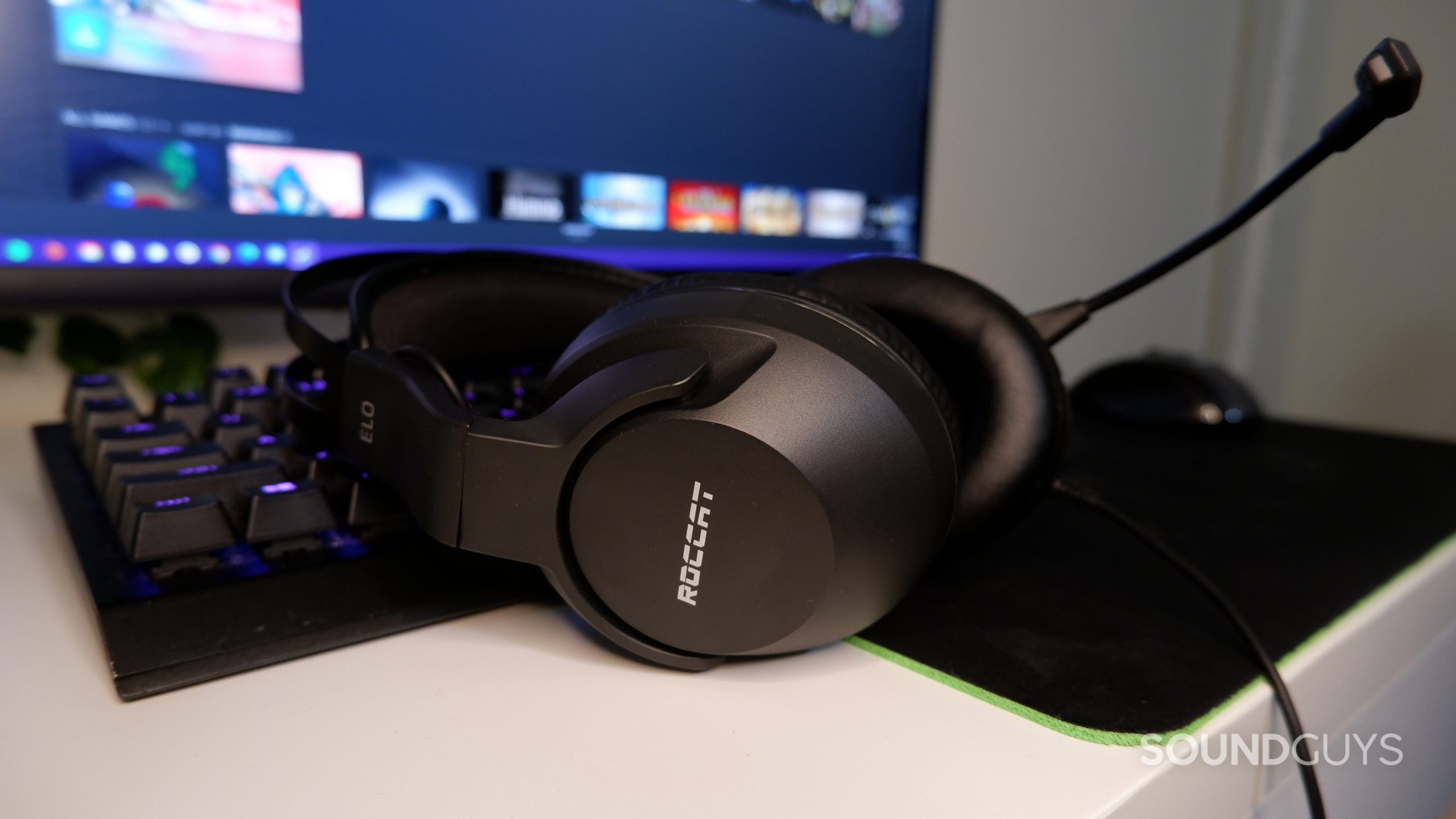 The ROCCAT Elo X Stereo resting against a keyboard on a desk.