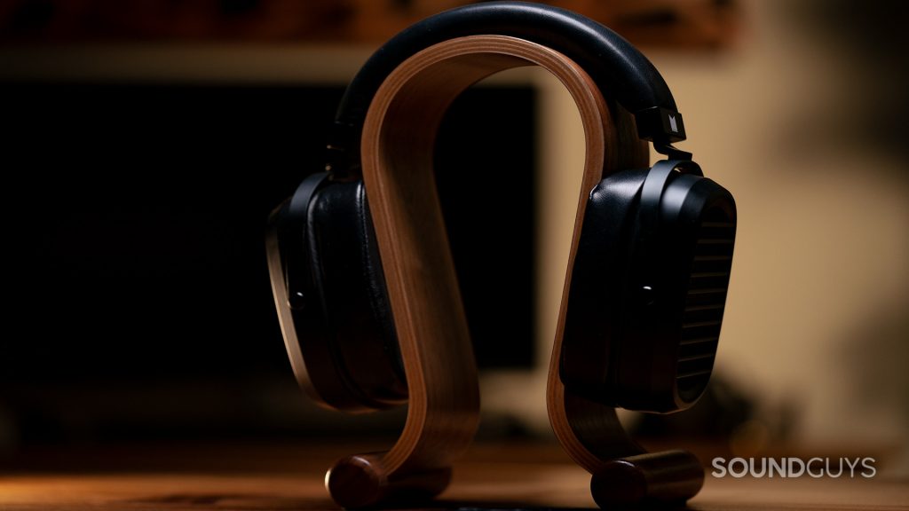 The Monoprice Monolith AMT sitting on an omega-shaped headphone stand.