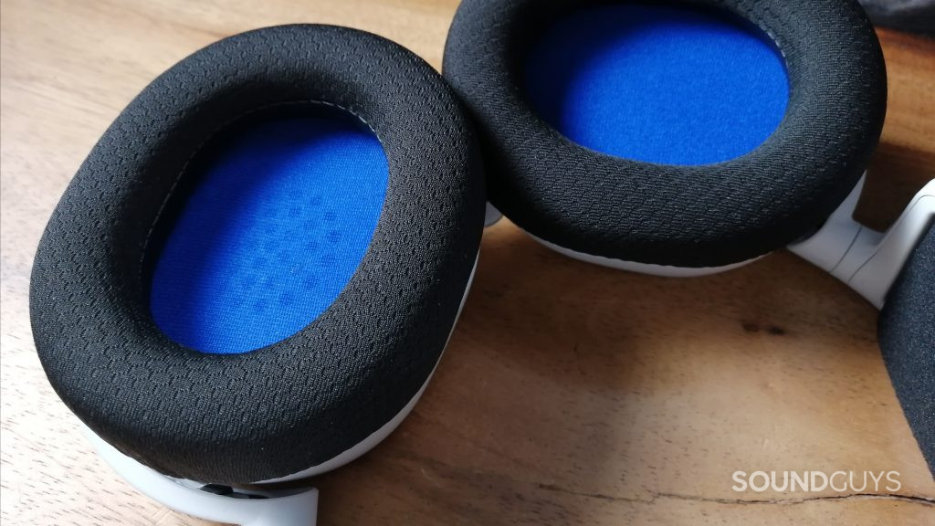The SteelSeries Arctis 7P+ Wireless lays flat on a table with the ear cups facing upward.