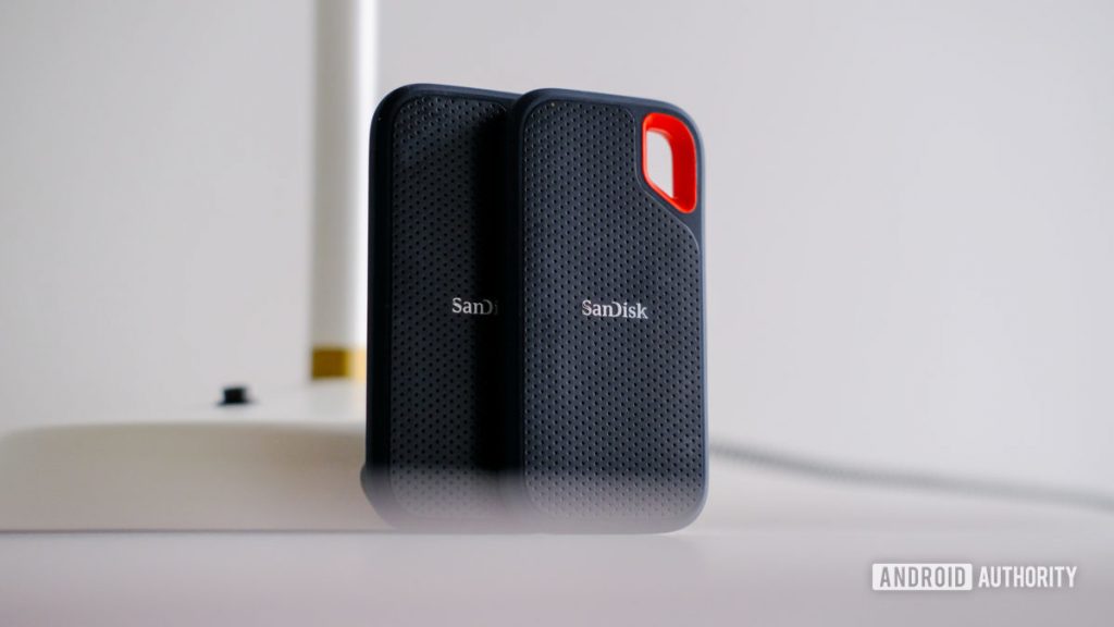 The Sandisk Extreme Portable SSD 2 rest on a table upright.