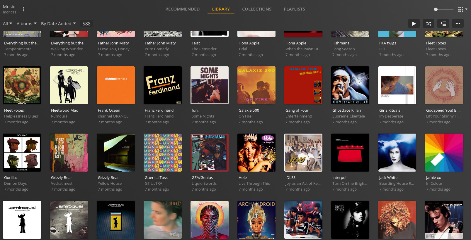 Plex's music library interface showing several different album covers along with artists and titles.