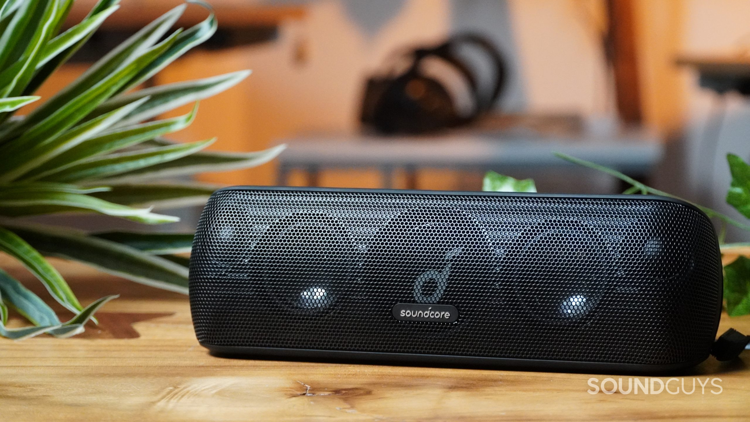 Anker Soundcore Motion+ speaker on a table with plants