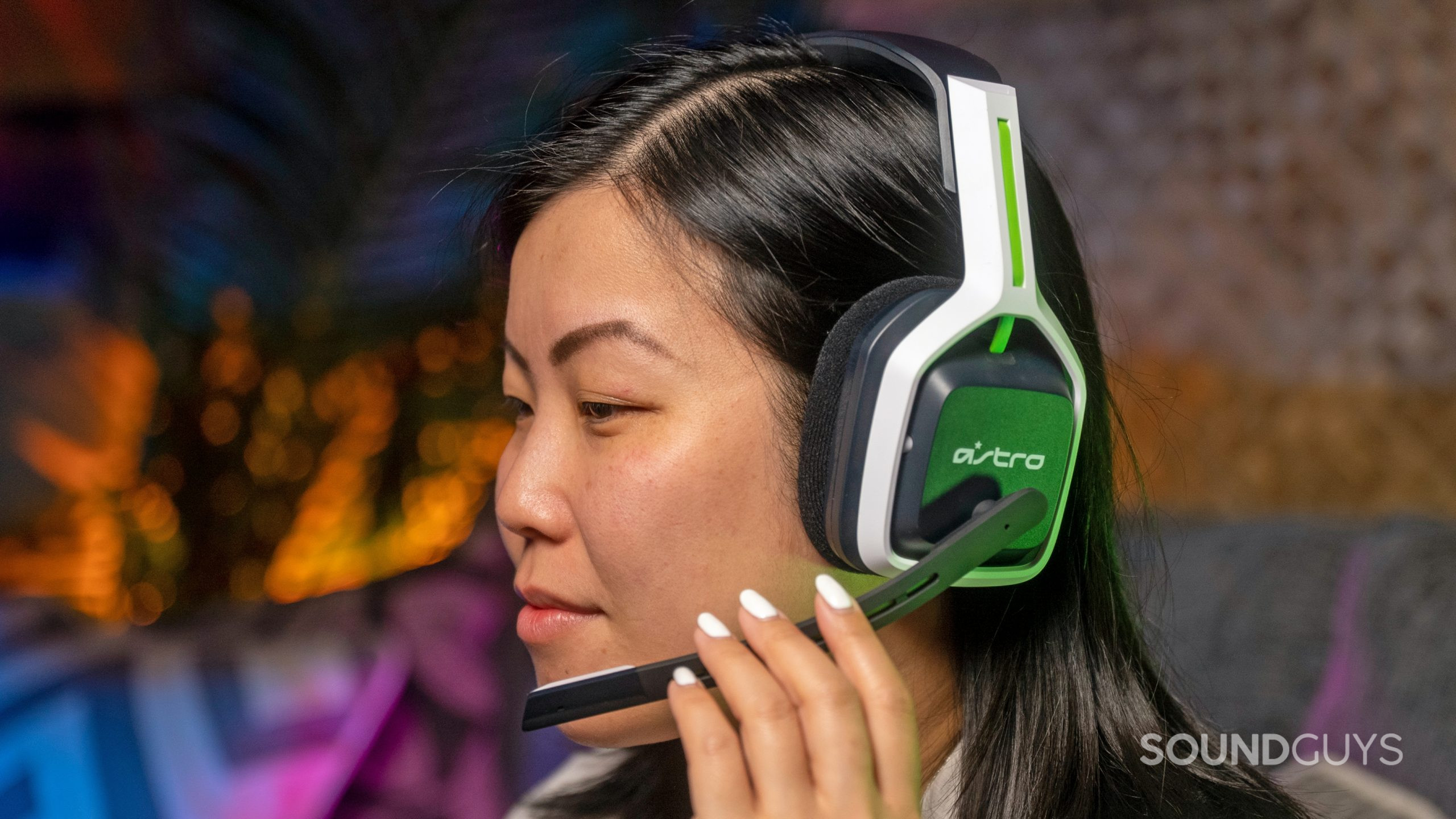 A woman wears the Astro A20 gaming headset at the SoundGuys offices.