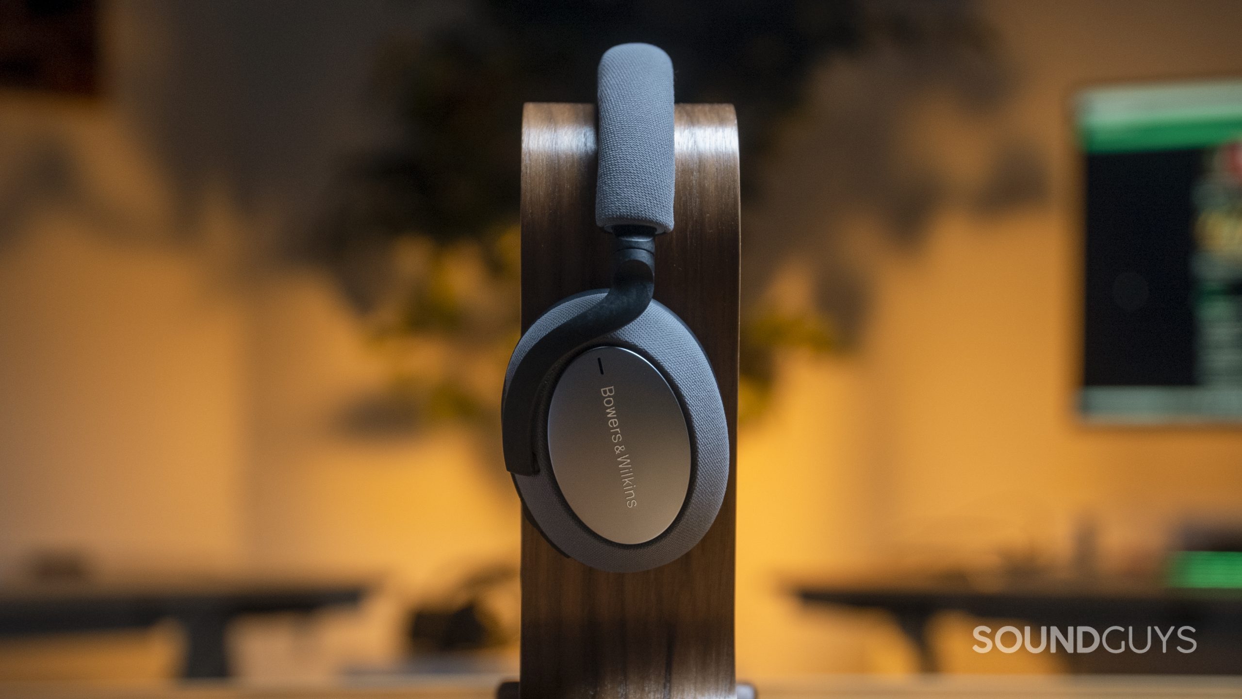 The Bowers & Wilkins PX7 sitting on a headphone stand.
