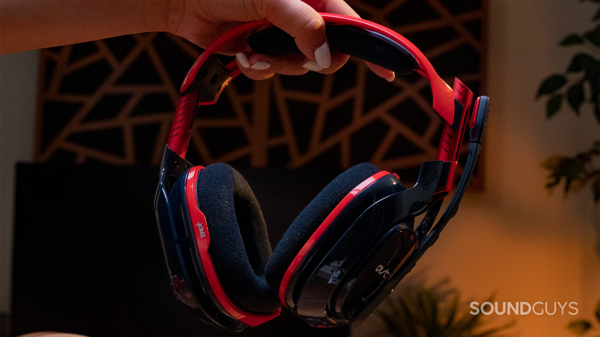 The Astro A40 being held by a single hand.