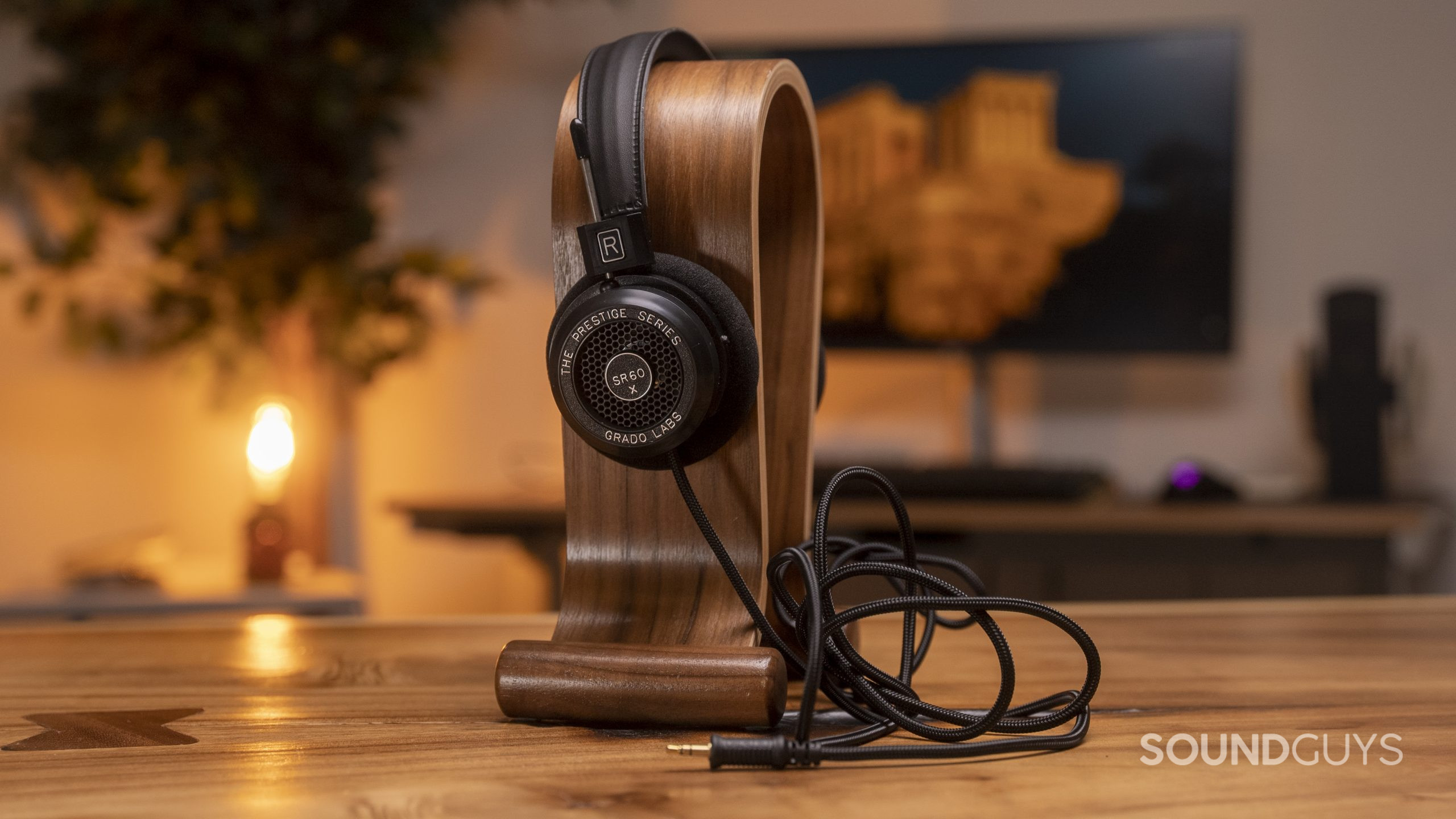 The Grado SR60x in black on top of an omega headphone stand.