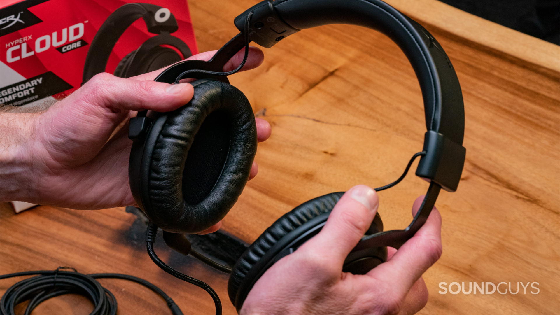 HyperX Cloud Core Handheld 1 The HyperX Cloud Core being held in two hands showing the sides