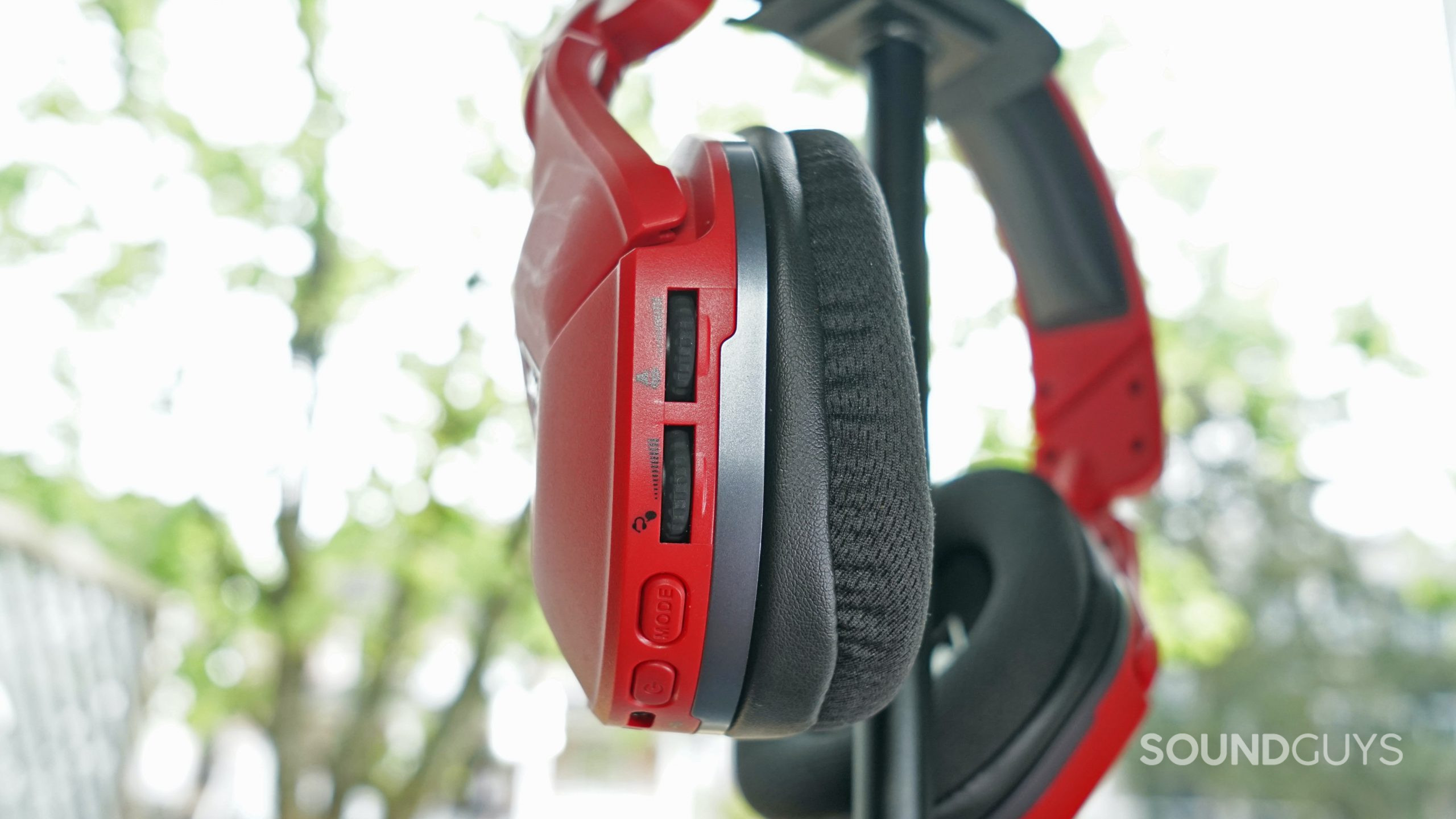 The Turtle Beach Stealth 600 Gen 2 MAX sits on a headphone stand with its on-ear controls in focus.