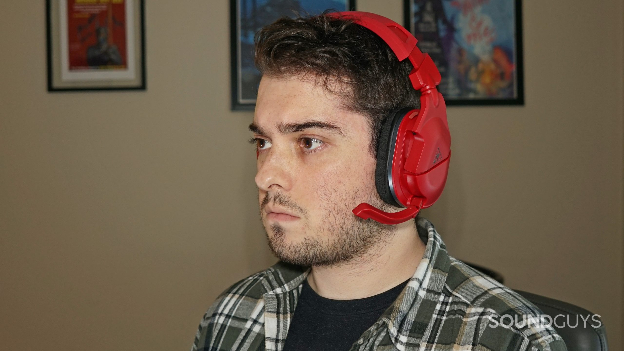 A man wears the Turtle Beach Stealth 600 Gen 2 MAX gaming headset while sitting at a PC.