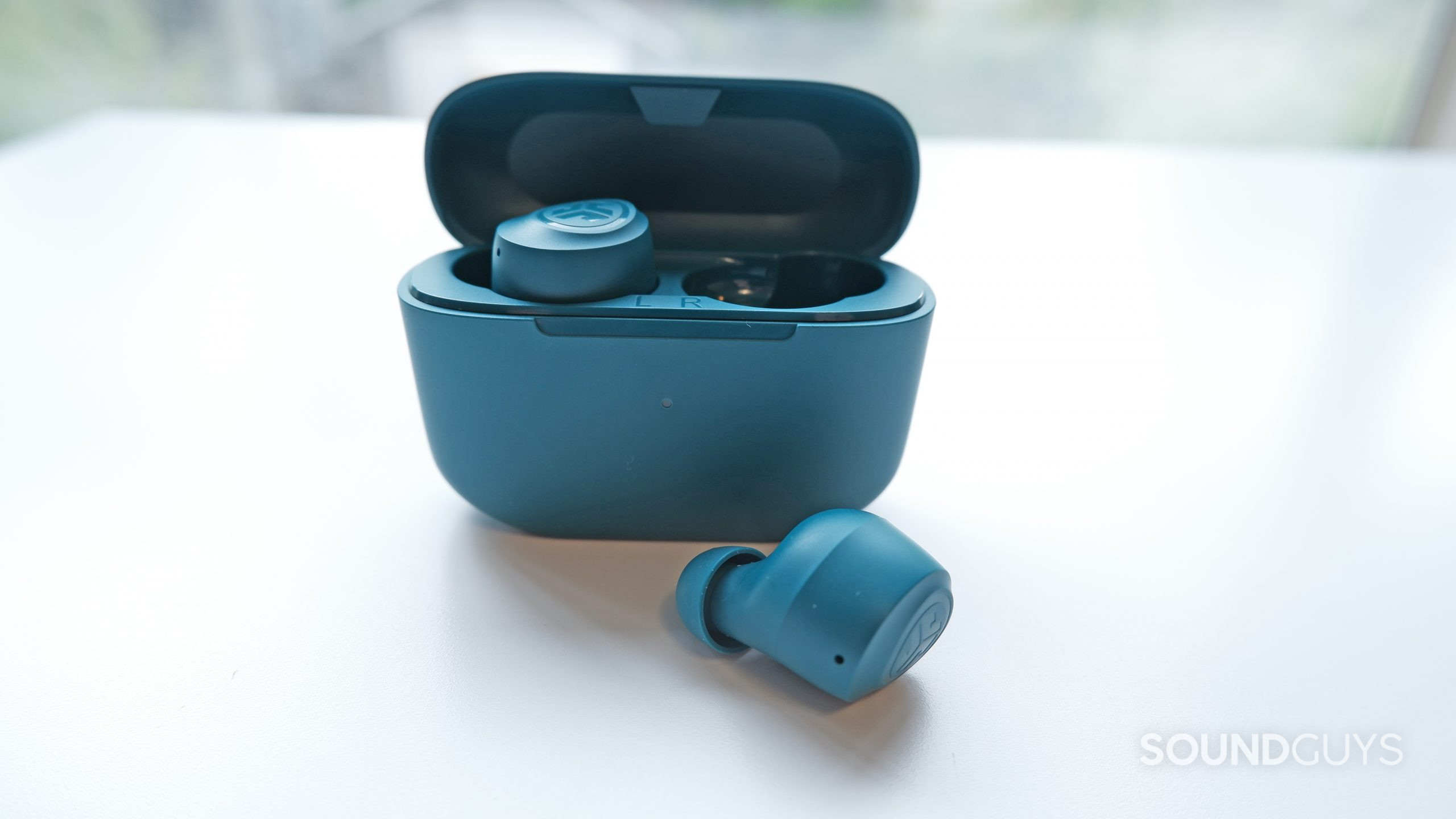 The JLab GO Air POP with one earbud outside of the case.