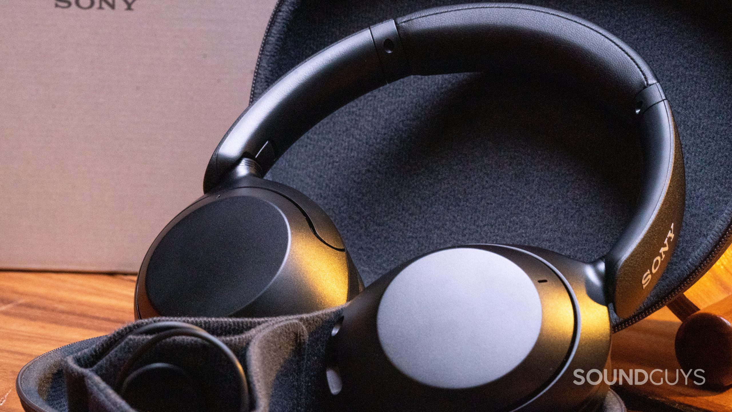 Close up image of the Sony WH-XB910N propped up in its case with the ear cups folded flat.