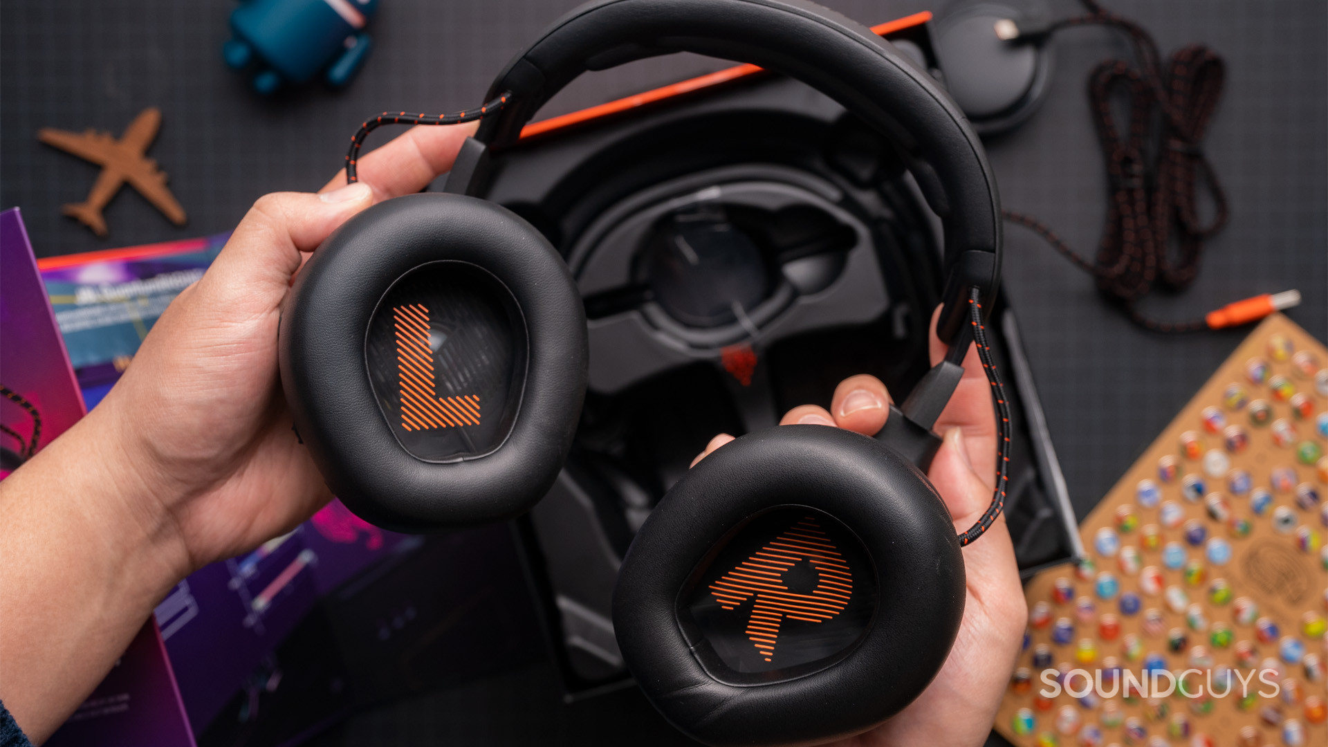 The JBL Quantum One with the ear cups rotated to face the viewer, showing the L and R letters on either side.