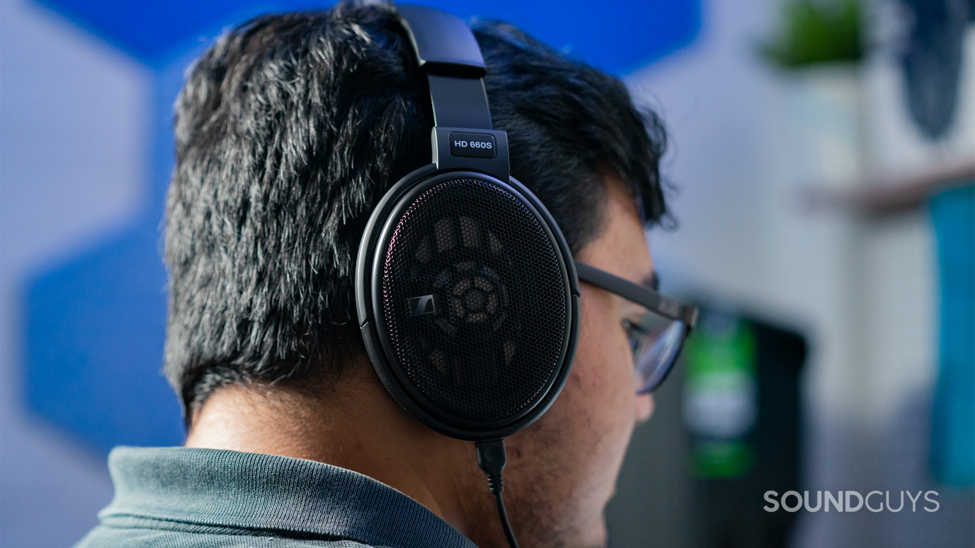 The Sennheiser HD 660S shown in profile on man's head.