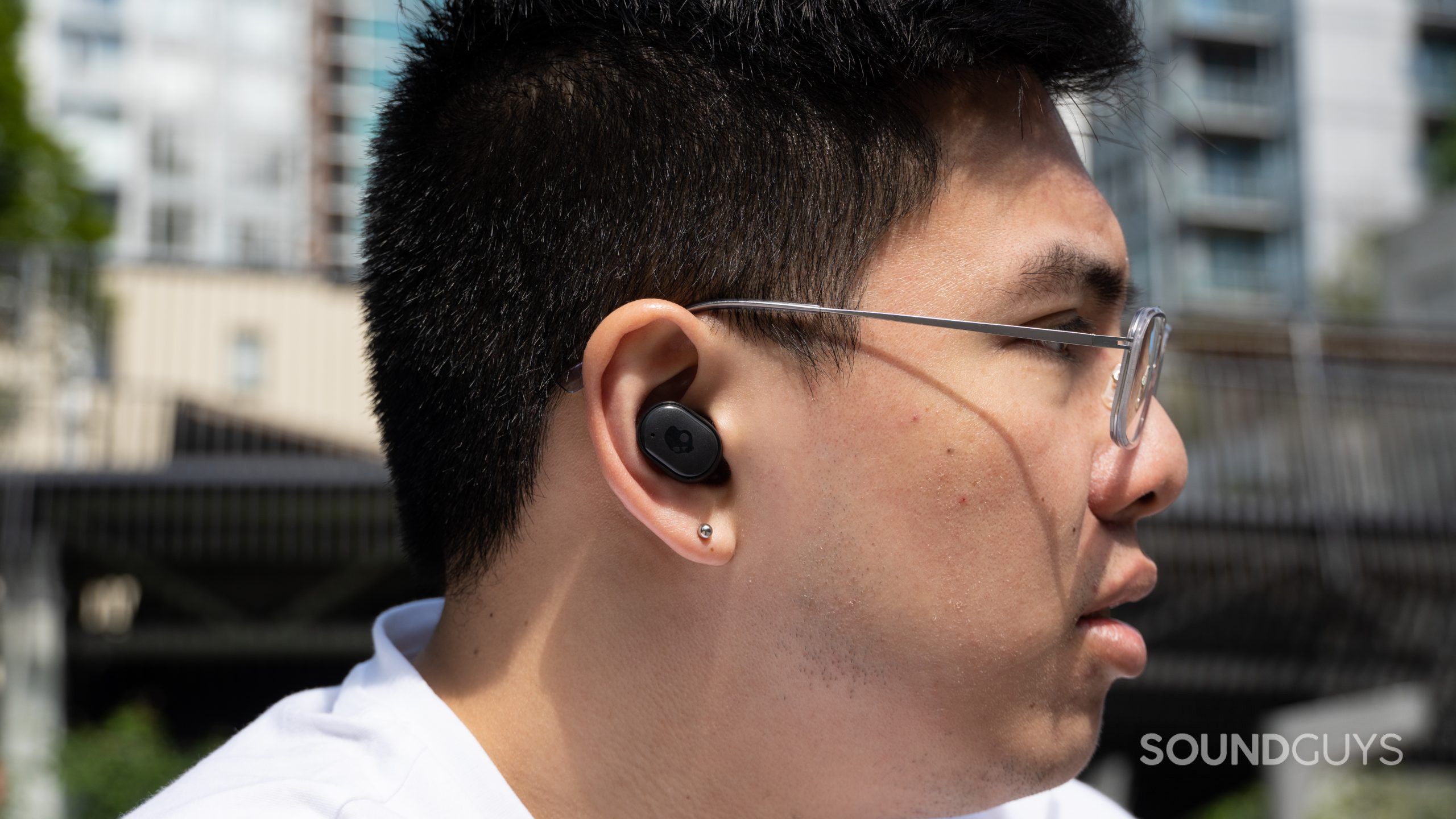 Skullcandy Grind True Wireless Earbuds worn outside.