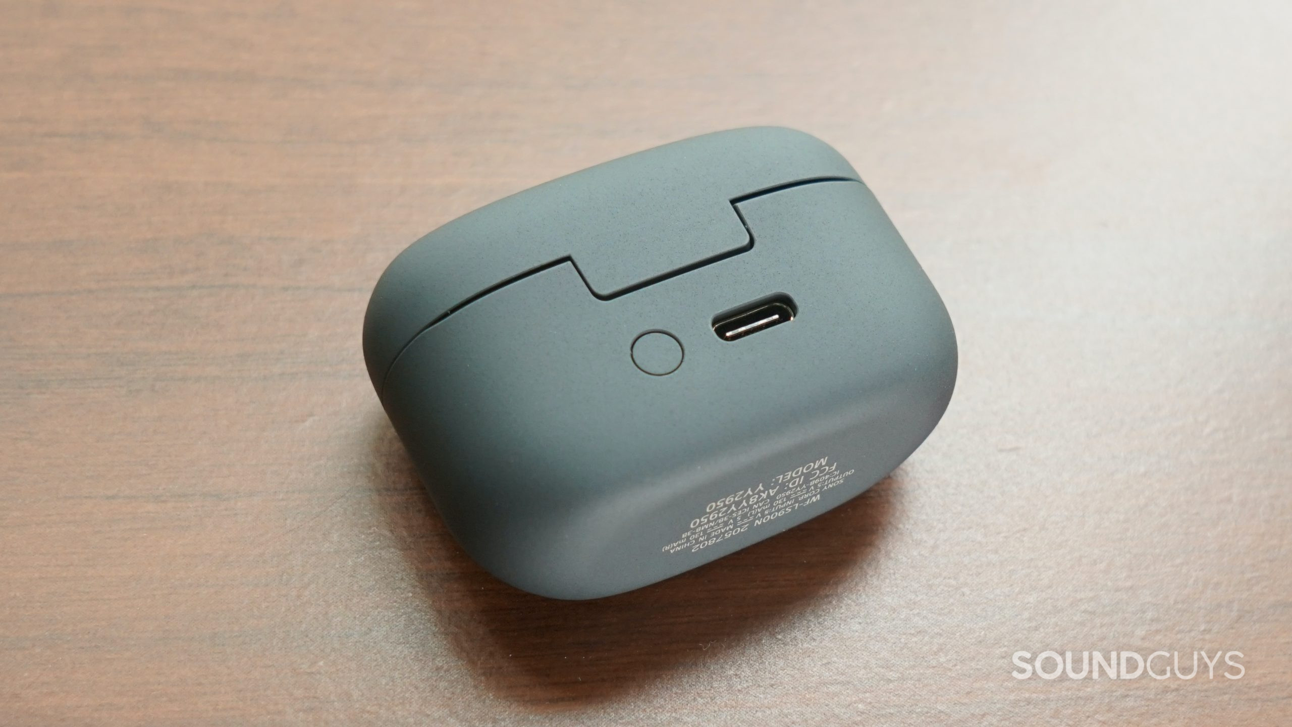 The Sony LinkBuds S case lays on its side with its charging port facing up.