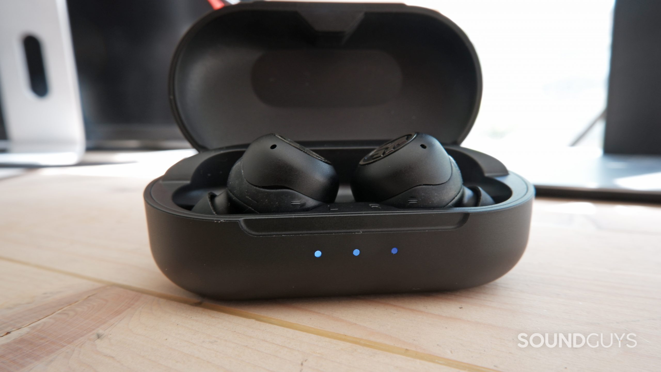 The JLab JBuds Air Pro case with battery indicator lights on.