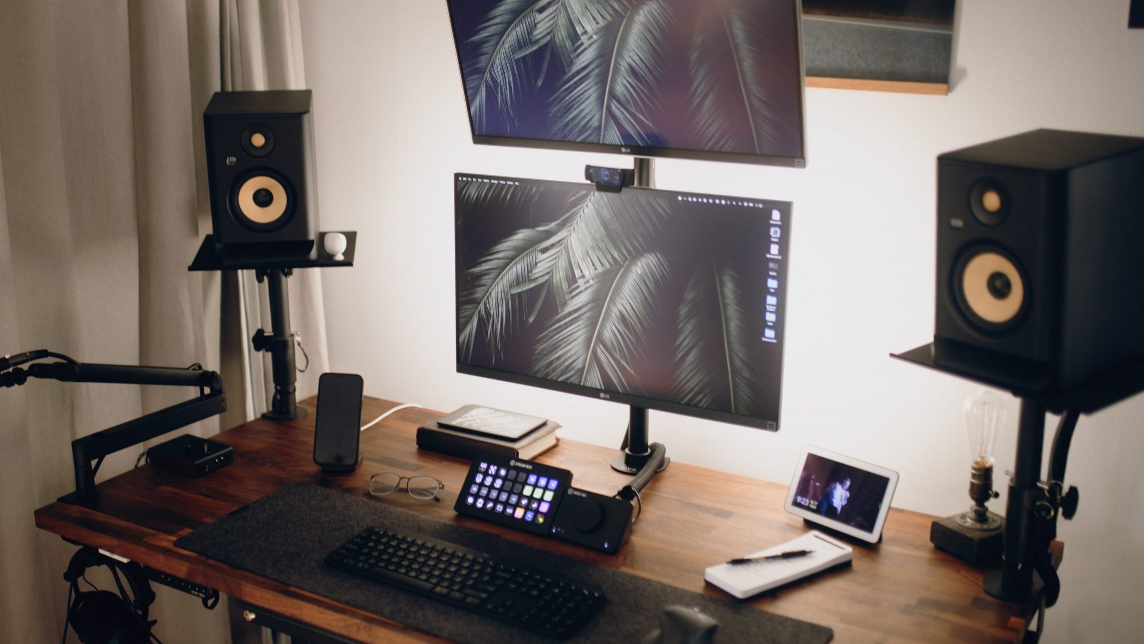 A desktop setup with computer speakers and dual monitors.