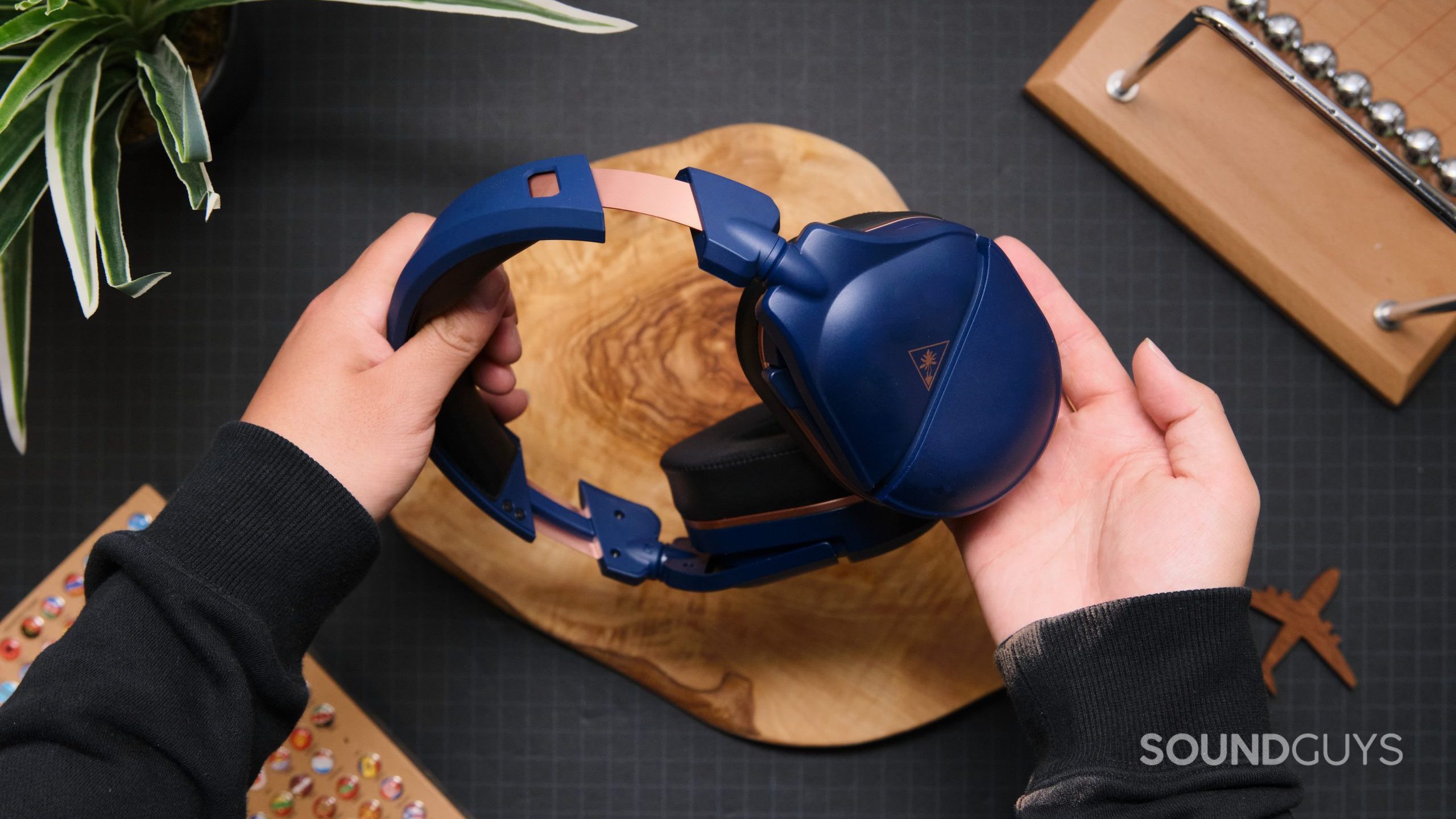 The Turtle Beach Stealth 700 Gen 2 MAX being held in two hands.